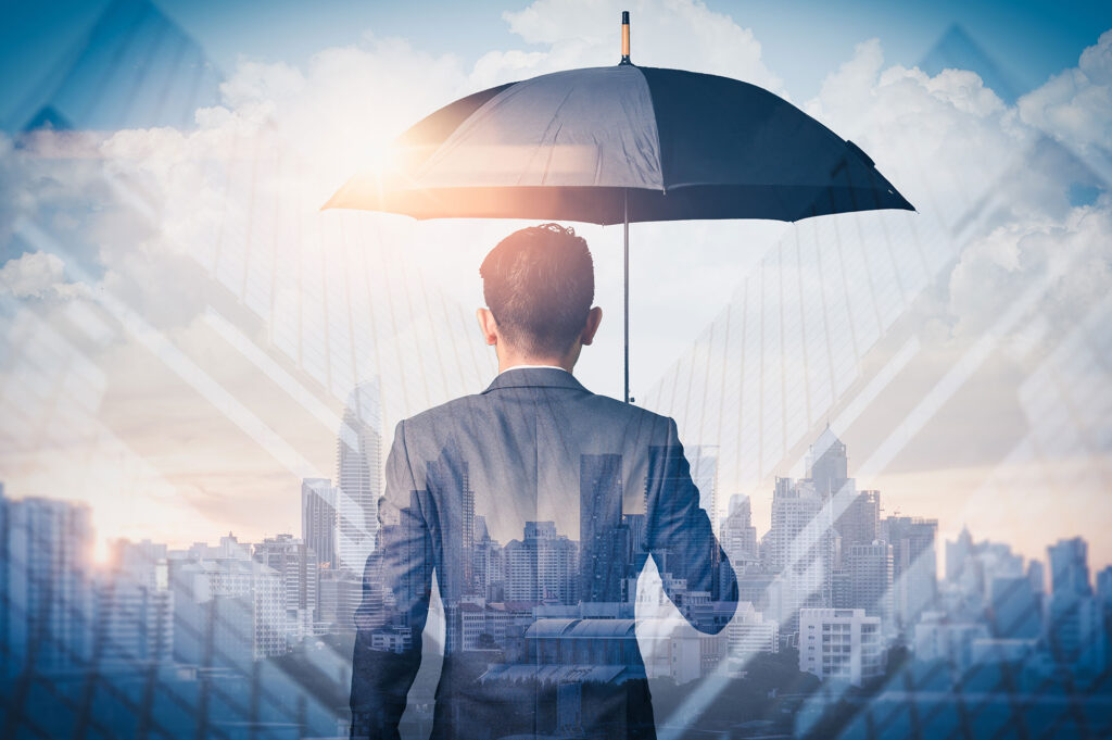 man holding umbrella in front of city concept insurance